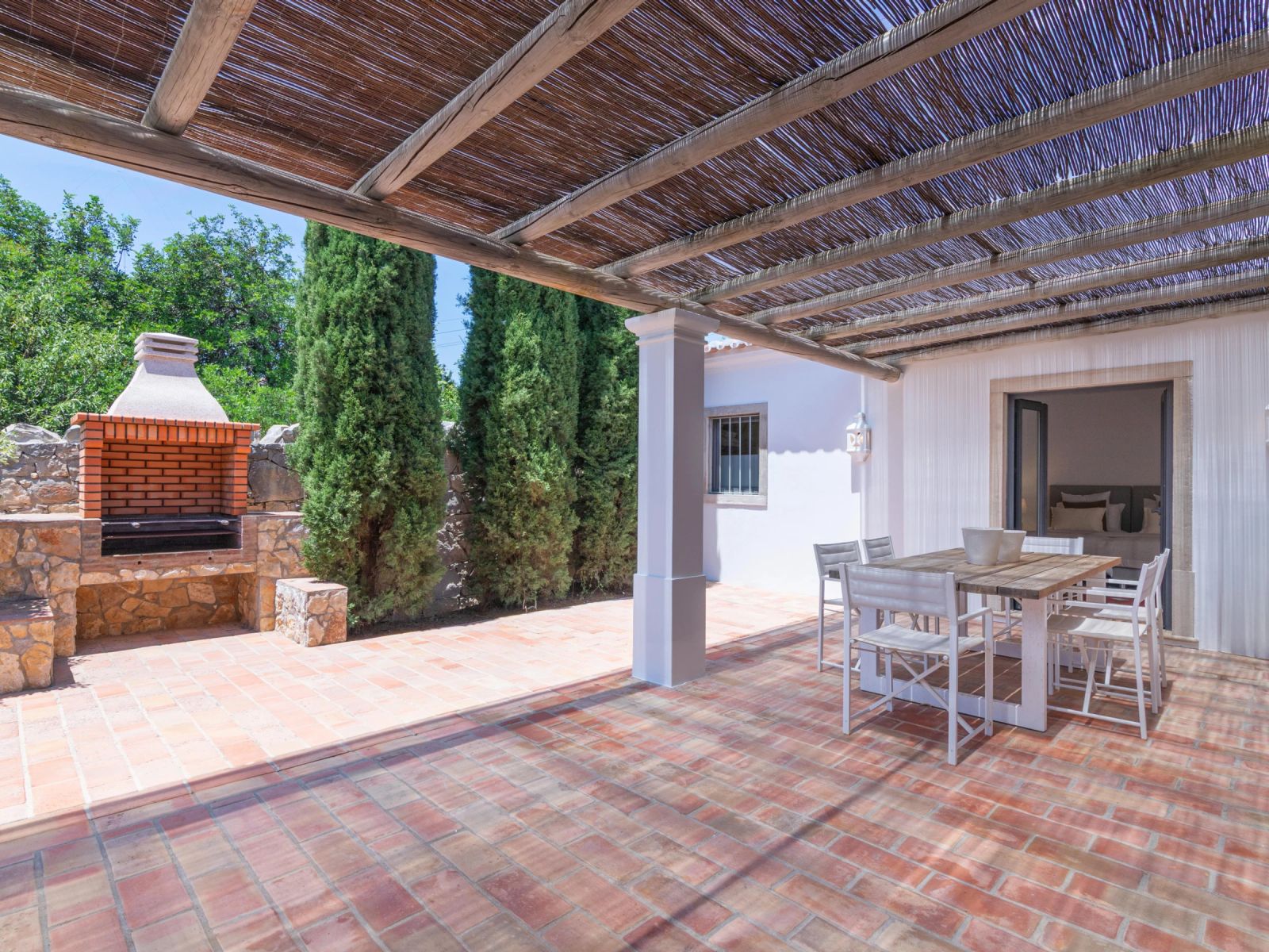 The villa's outdoor BBQ and dining area