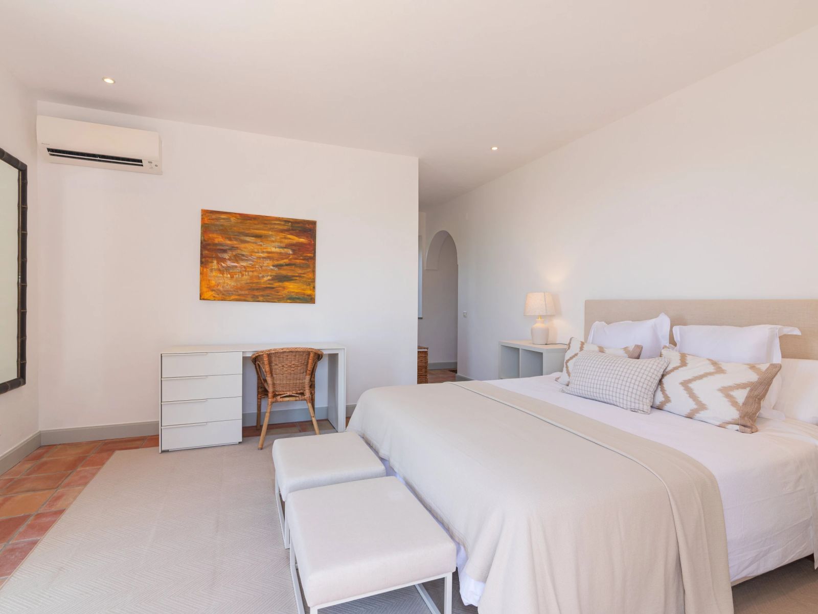 A bedroom at the villa with a desk