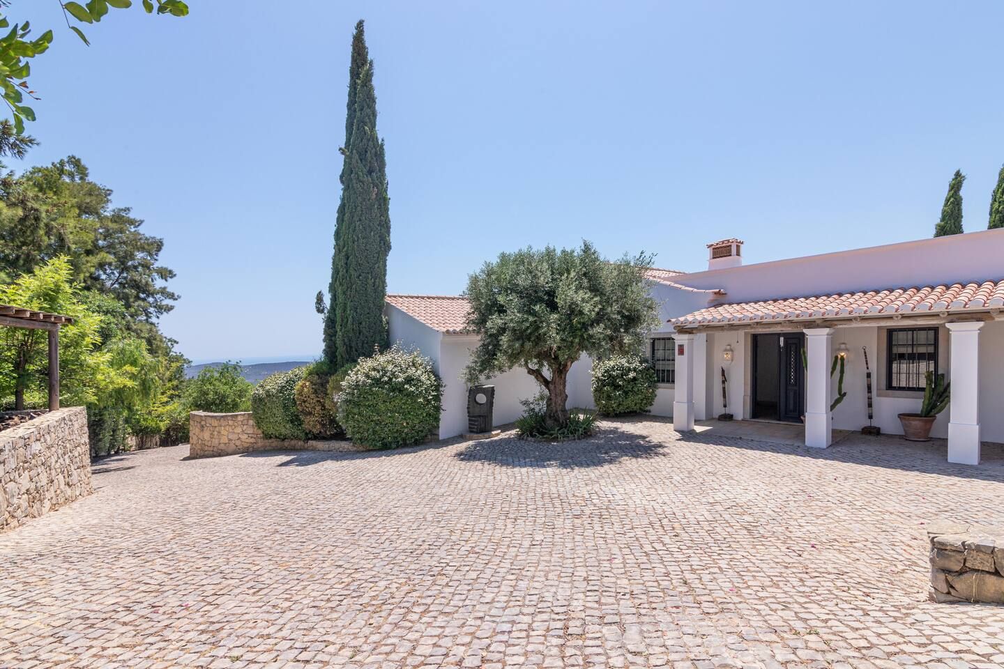 The villa's front entrance and courtyard