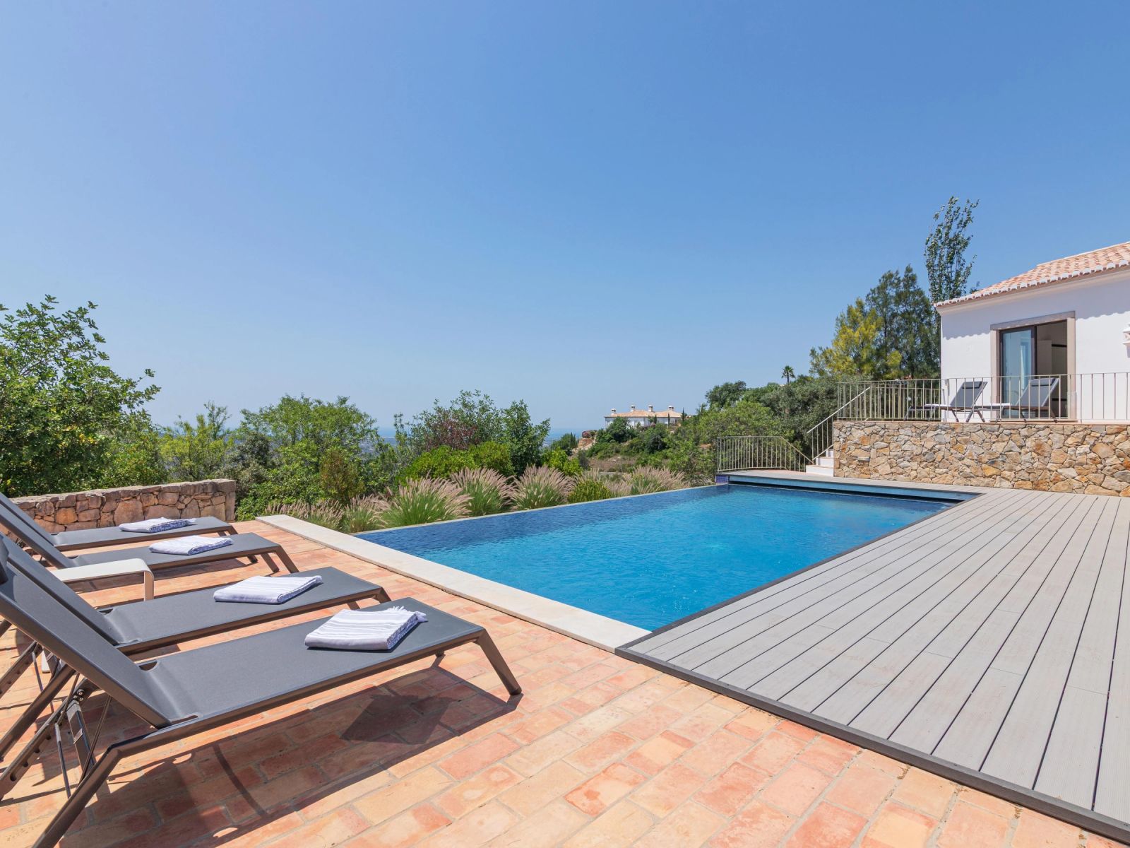 The villa's pool deck