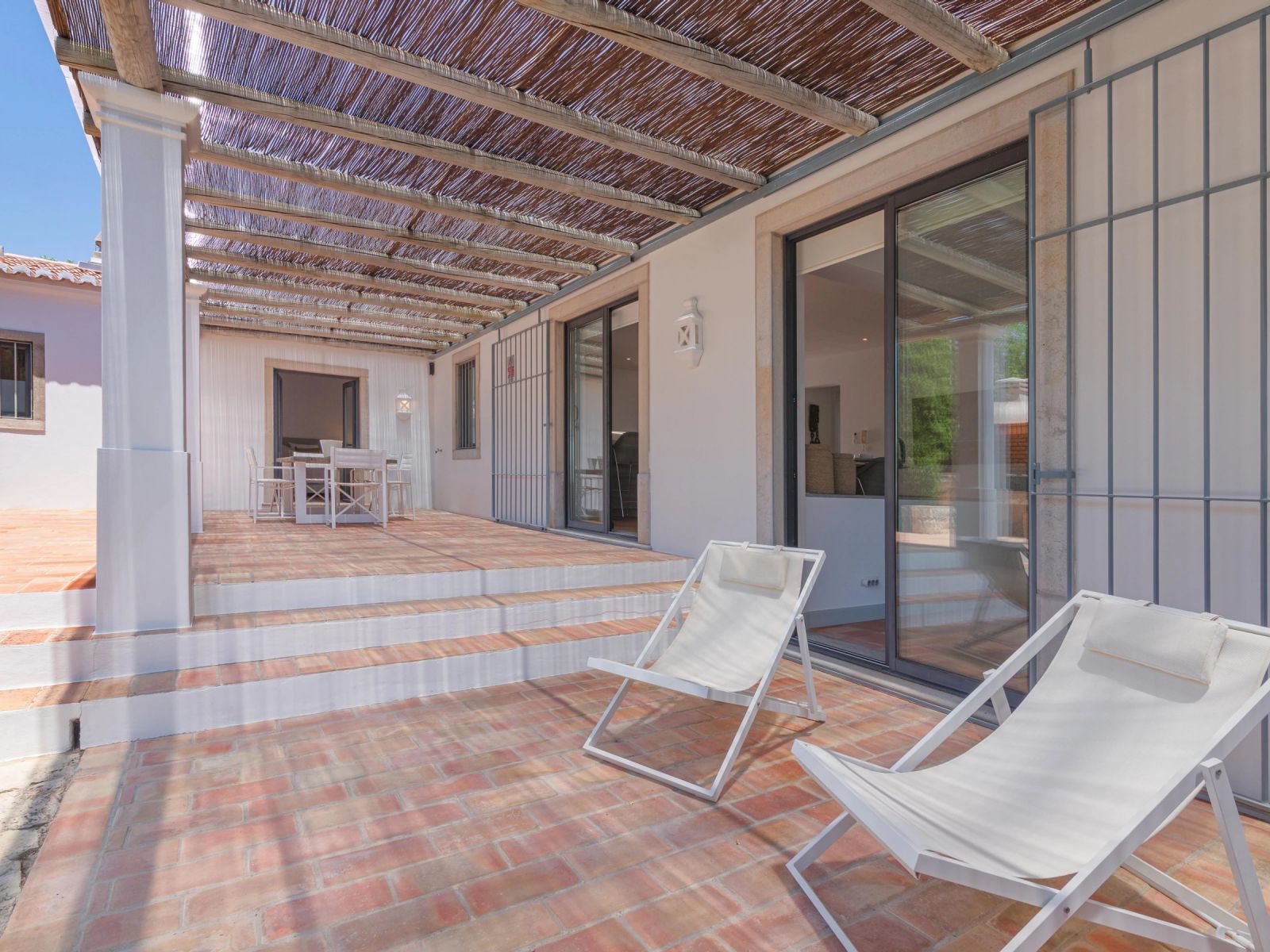 The villa's terrace with sun loungers